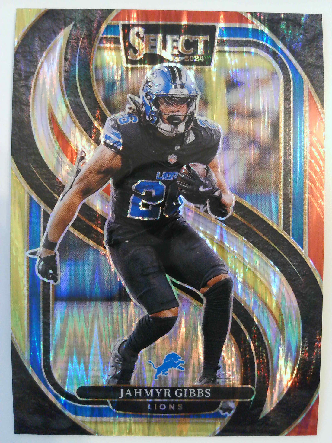2024 Panini Select Football Black & Orange Prizm Shock Jahmyr Gibbs #163
