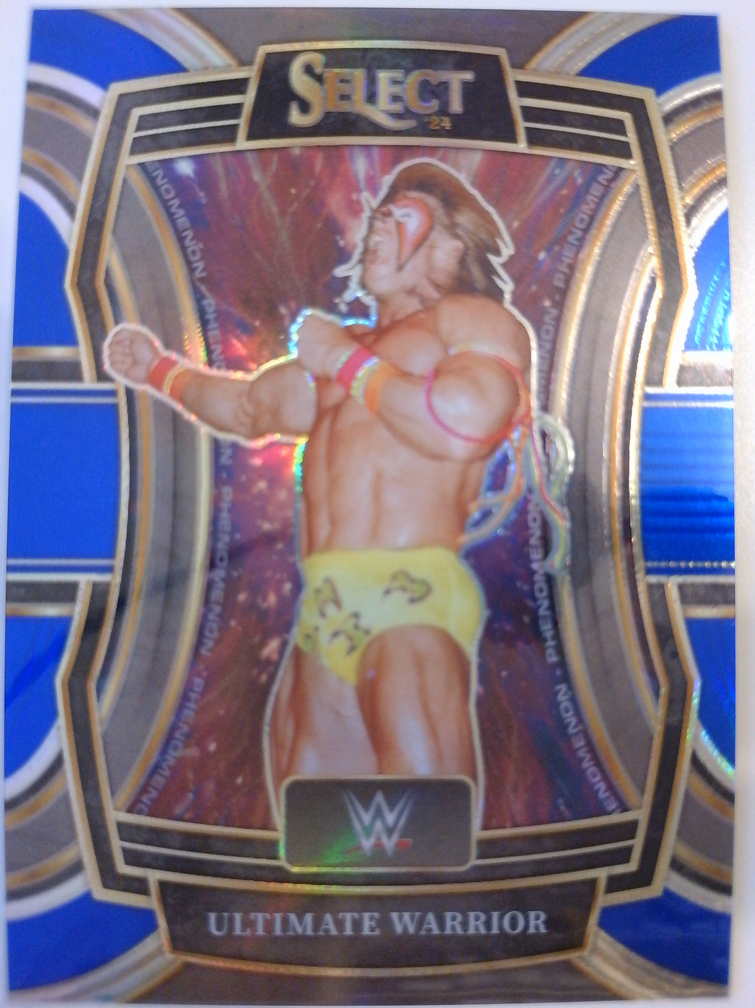 2024 Panini Select WWE Blue Wave Prizms 23/49 Ultimate Warrior #18